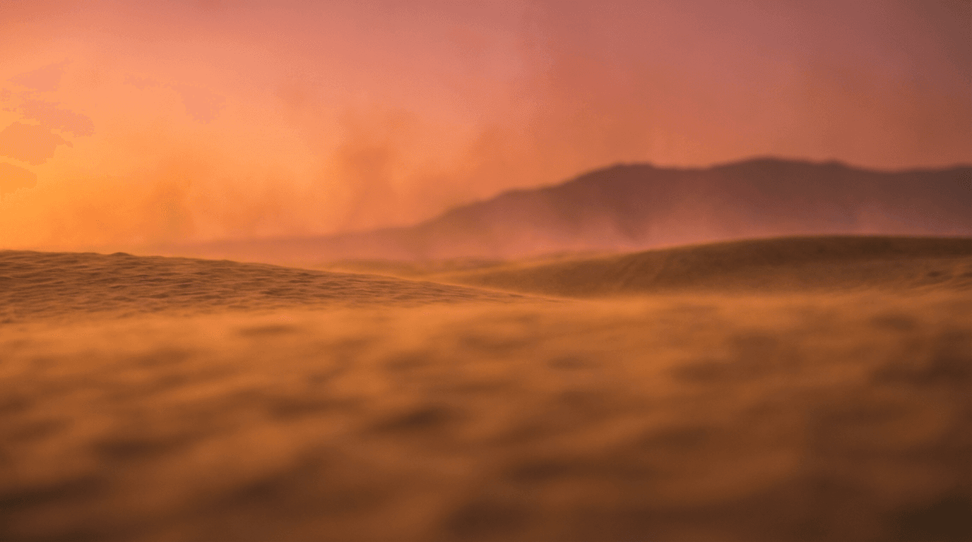 Traveler walking across sand dunes